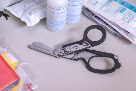 Person holding an open Raptor Rescue showing the shears.